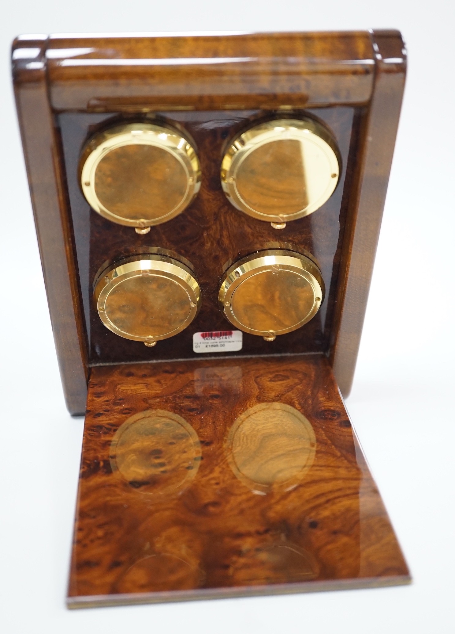 An Asprey burr wood veneered desktop four time zone timepiece, 15.5 cm